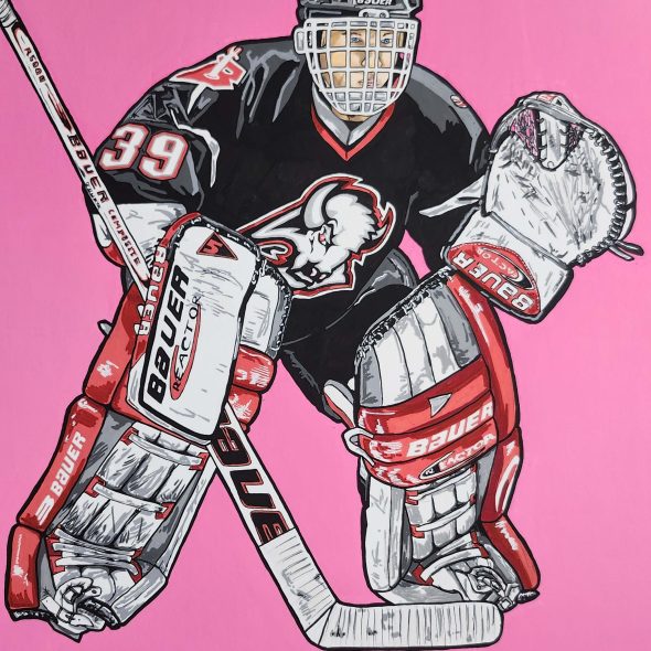 Dominik Hasek preparing to make a save while playing for the Buffalo Sabres