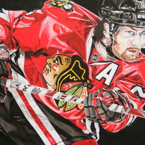 Portrait of Duncan Keith following through on a shot while playing for Chicago.